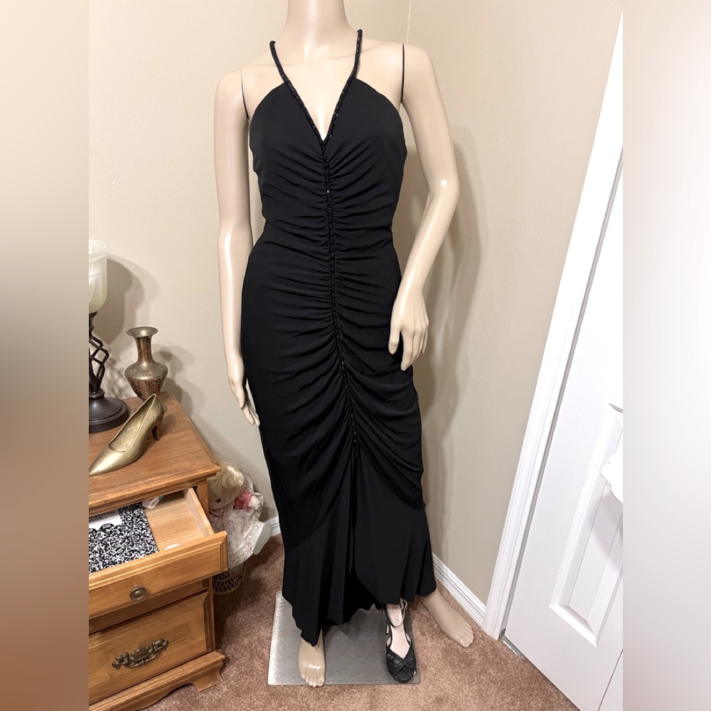 Beaded black dress with v-neck and spaghetti straps.  So feminine.